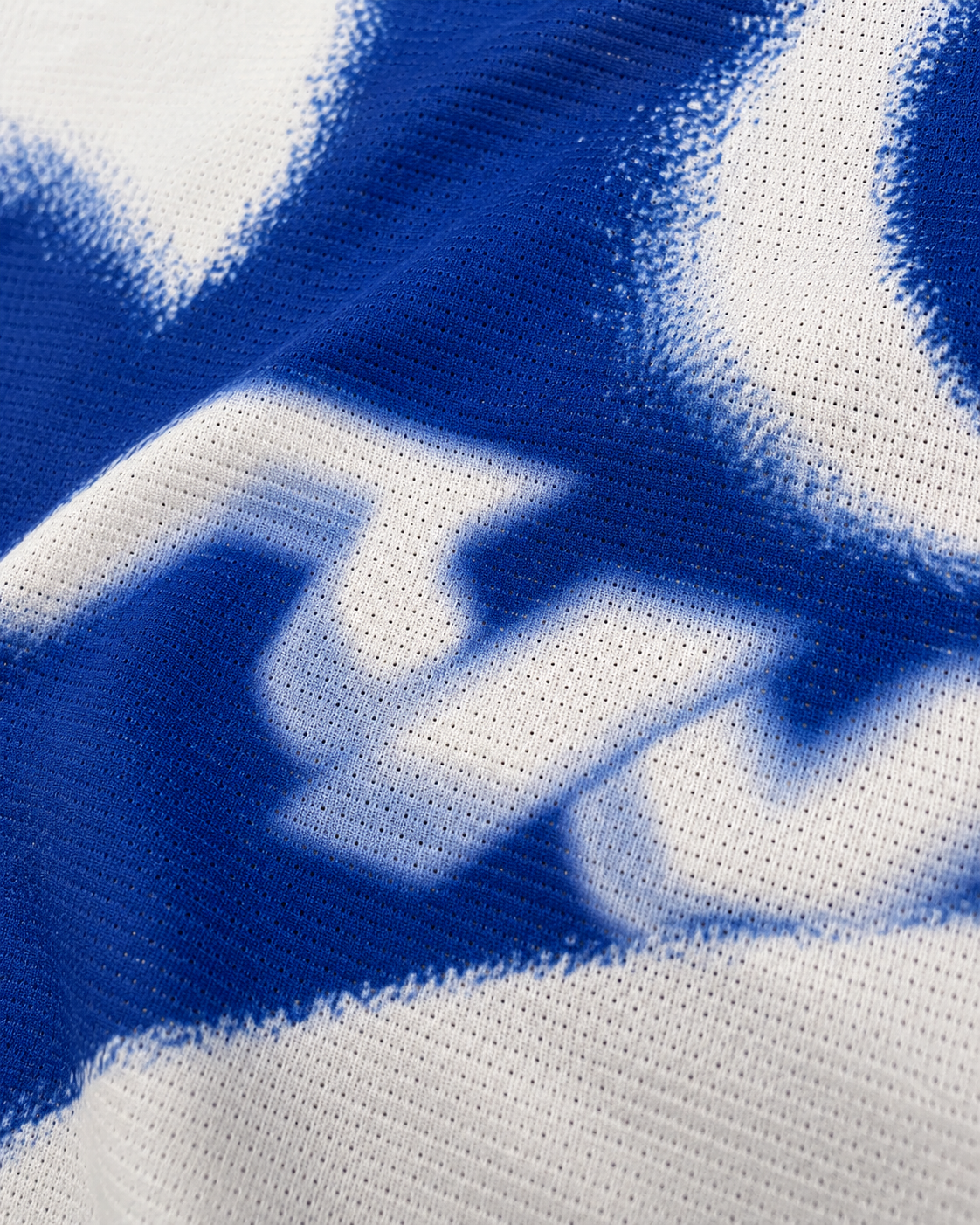 Close-up of the fine mesh knit and blue Mileworn print